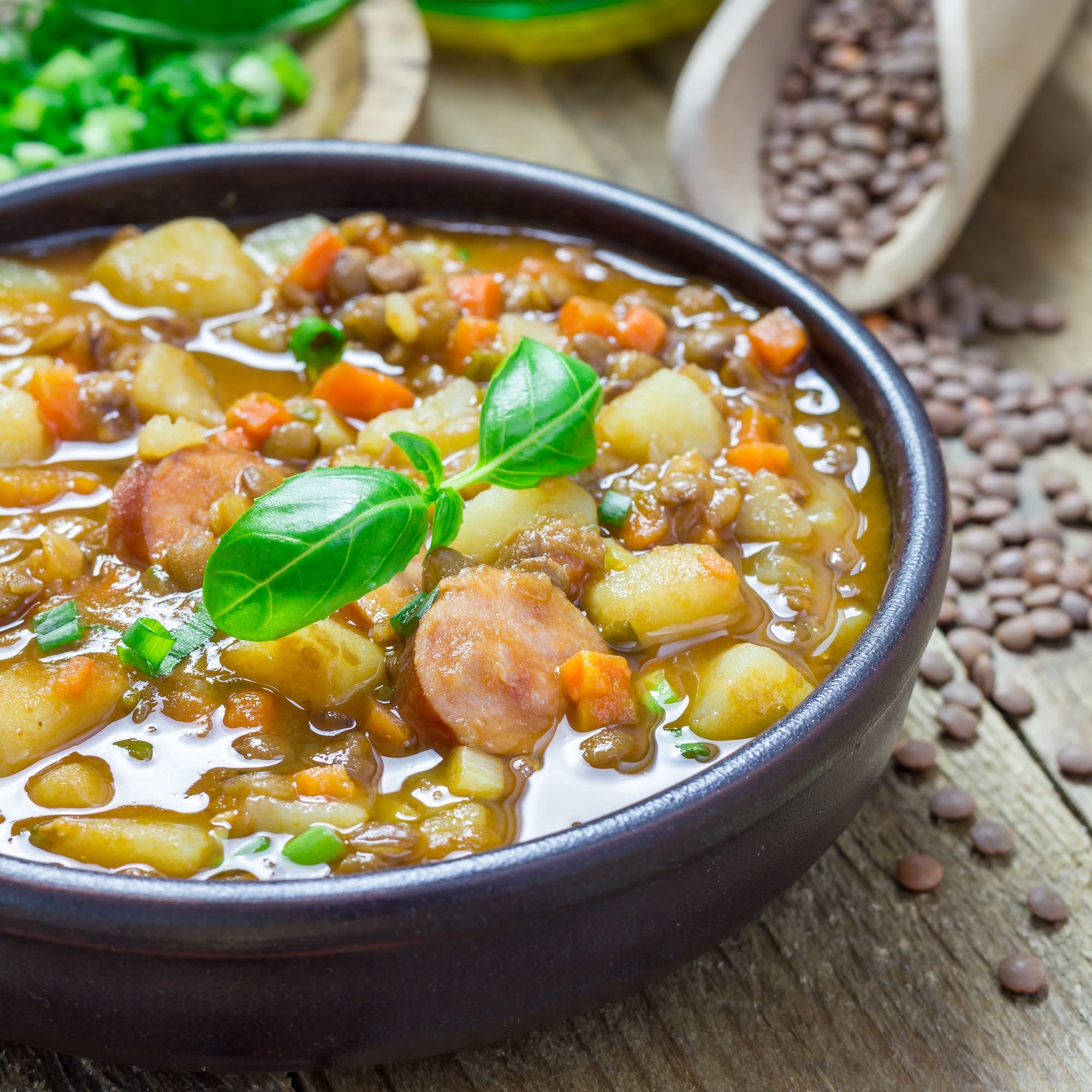 Homemade soup with lentils and sausages, square