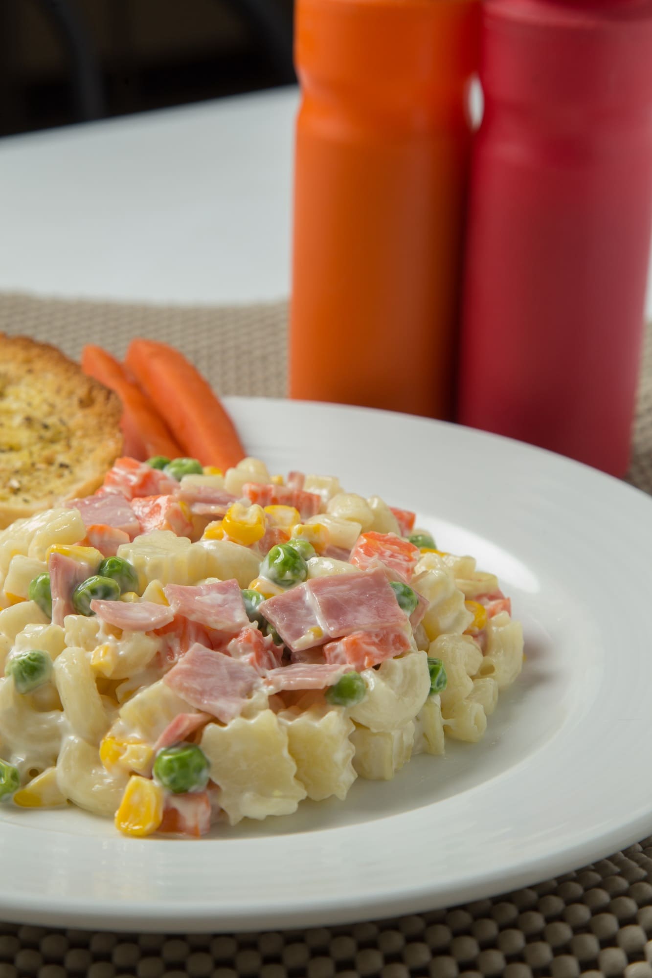 Macaroni salad with mayonnaise and vegetables.
